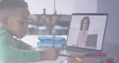 Young Student Engaged in Online Math Lesson at Home