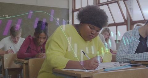 African american student concentrating on writing in classroom with visualization overlay