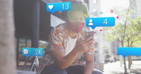 Man Engaging with Social Media Icons on Smartphone