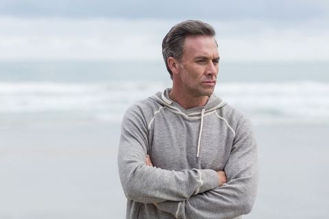 Pensive Man Reflecting on Quiet Seashore - Download Free Stock Images Pikwizard.com