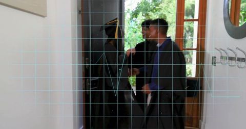 Graduates gathering and chatting in entryway with cyan grid overlay