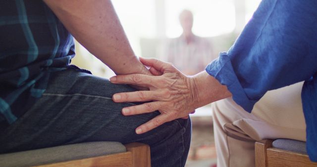 Comforting Hands, Elderly Friends Supporting Each Other in Group Setting - Download Free Stock Images Pikwizard.com