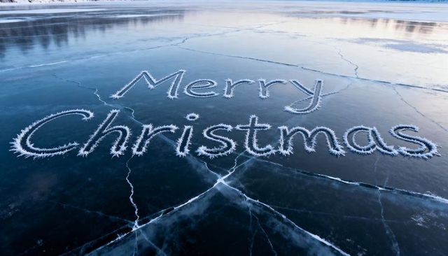 Spelling Merry Christmas in Hoarfrost on Cracked Lake Ice at Sunrise