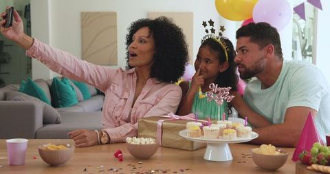 Happy Family Celebrating Birthday with Selfie