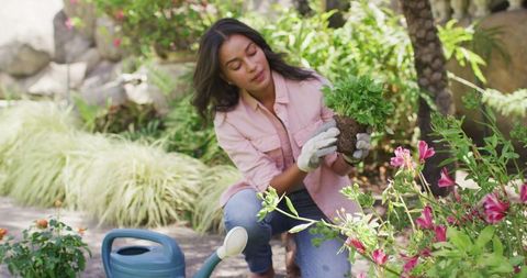 Focused Woman Engaging in Gardening at Home