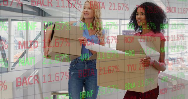 Two Female Employees Relocating Office with Stock Market Data Overlay - Download Free Stock Images Pikwizard.com