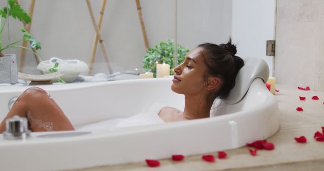 Woman Relaxing in Bathtub with Rose Petals and Candles in Modern Bathroom - Download Free Stock Images Pikwizard.com