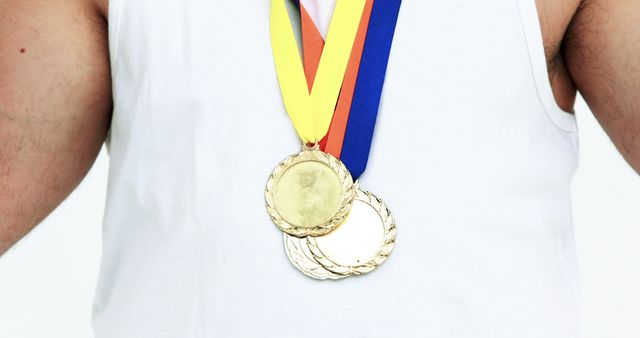 Athlete Wearing Gold Medals Over White Tank Top - Download Free Stock Images Pikwizard.com