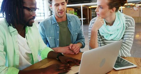 Multiracial Team Discussing Project at Work Over Laptop - Download Free Stock Images Pikwizard.com