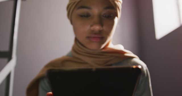 Young Woman Wearing Hijab Using Digital Tablet Indoors - Download Free Stock Images Pikwizard.com