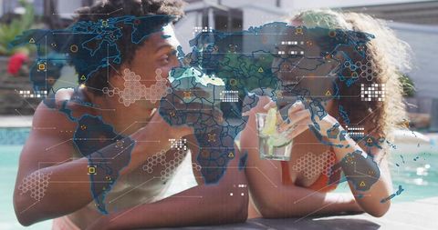 Couple lounging poolside chatting and sipping lime drinks with global digital map overlay