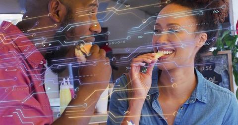 Diverse Individuals Enjoying Digital Connection Over Meal