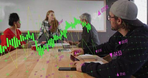 Team analyzing financial data overlay during collaborative meeting with tablet