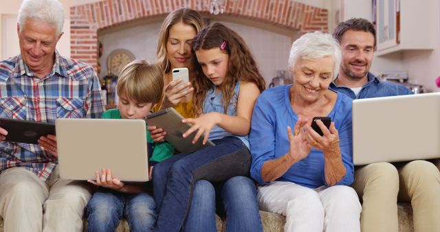 Three Generations Family Using Gadgets Together on Couch - Download Free Stock Images Pikwizard.com