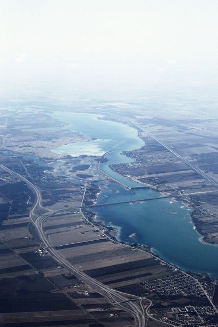 Aerial View of Large Body of Water and Field - Download Free Stock Photos Pikwizard.com