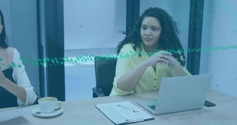 Focused Professional Reviewing Agenda at Office Meeting