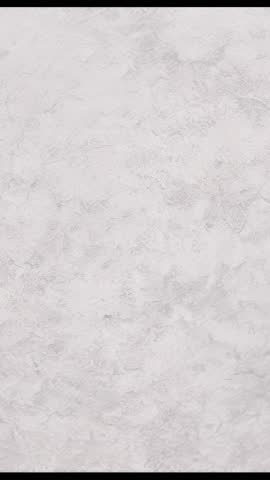 Vertical video showing gray plaster wall texture for minimalist modern interior background