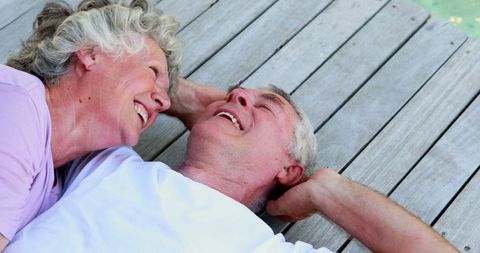 Happy Senior Couple Laughing Together Outdoors