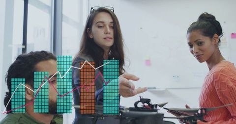 Engineer collaborating on drone prototype with data chart overlay