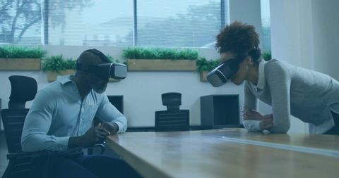 Business Colleagues Exploring Virtual Reality in Modern Workspace