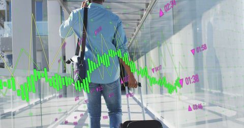 Businessman in airport with overlay of growth graphs and data analysis