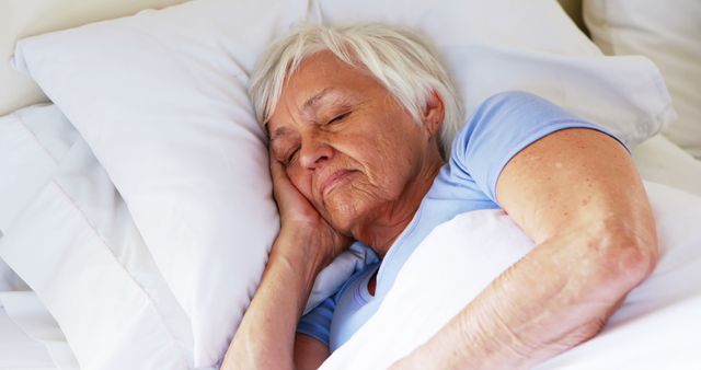 Senior woman sleeping in the bedroom at home - Download Free Stock Photos Pikwizard.com