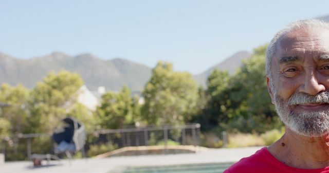 Senior Man Smiling Outdoors with Mountain Backdrop on Sunny Day - Download Free Stock Images Pikwizard.com