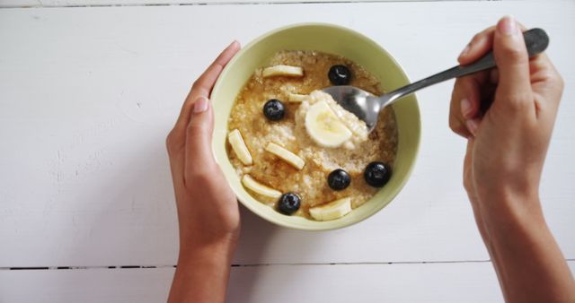 Woman having healthy breakfast on white background 