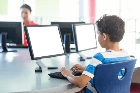 schoolboy using transparent computer in classroom setting - Download Free Stock Videos Pikwizard.com