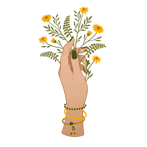 Elegant hand holding yellow daisies with fern adds botanical charm