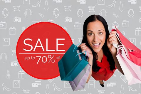 Joyful Woman Shopping with Sale Sign Promoting Discount Event