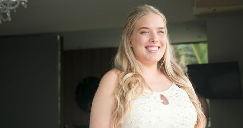 Happy Bride with Bridesmaids Preparing for Wedding Ceremony