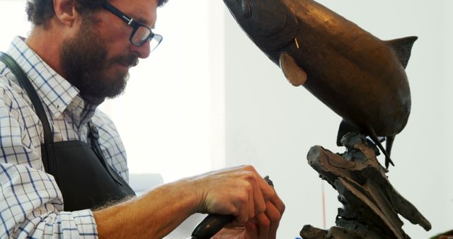 Sculptor Working on Metal Fish Statue in Studio - Download Free Stock Images Pikwizard.com