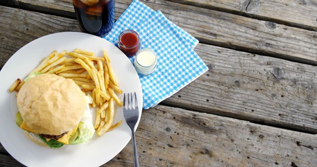 Cheeseburger and Fries on Rustic Picnic Table - Download Free Stock Images Pikwizard.com