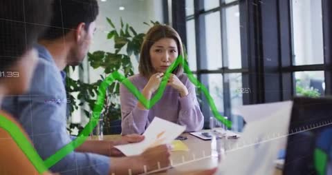 Team Discussing Financial Strategies with Overlaid Graph Presentation