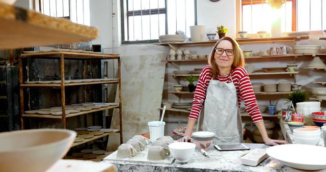 Happy Female Potter in Her Ceramic Workshop - Download Free Stock Images Pikwizard.com