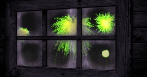 Vibrant Green Fireworks Outside Rustic Window