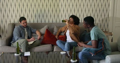 Friends Enjoying Drinks and Relaxed Conversation at Home