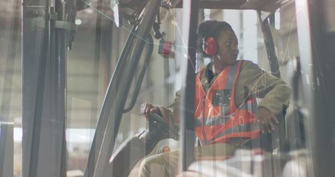 Warehouse Operator Analyzing Data on Forklift in Logistics Hub - Download Free Stock Images Pikwizard.com