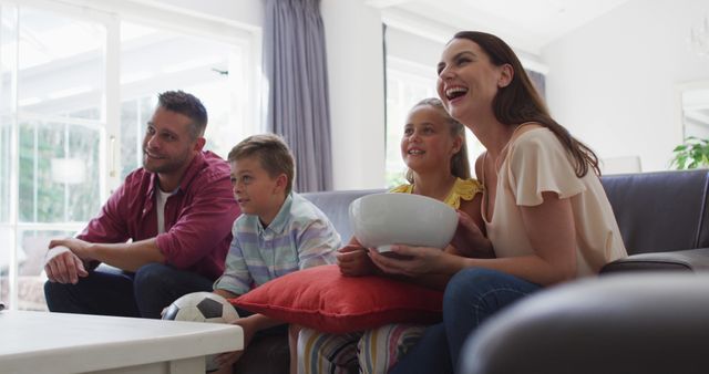 Happy Family Watching Television and Enjoying Together at Home - Download Free Stock Images Pikwizard.com