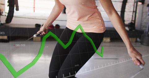 Woman exerciser jumping rope with green analytics overlay showing cardio progress and performance