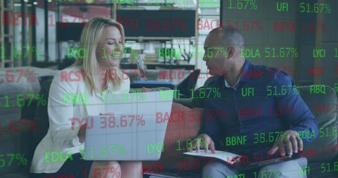 Business Colleagues Analyzing Digital Financial Data Together