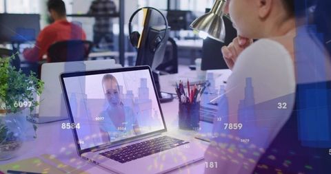 Female Professional Working on Laptop Video Call with Digital Finance Charts Overlay