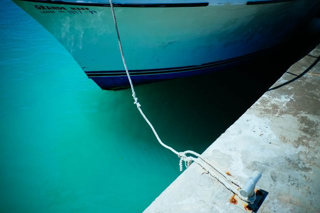 Bow of Boat Tethered to Dock in Crystal Blue Water - Download Free Stock Images Pikwizard.com