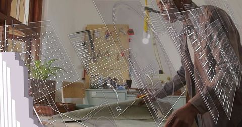 Craftsman using augmented reality to plan woodworking project on home workbench