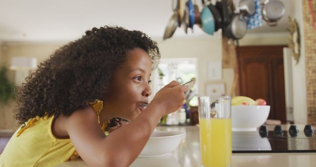 Young Girl Having Breakfast in Bright Modern Kitchen - Download Free Stock Images Pikwizard.com