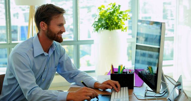 Professional Young Businessman Focused on Work at Office Computer - Download Free Stock Images Pikwizard.com