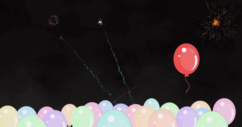 Floating red balloon hovering over pastel balloons at night with fireworks and copy space