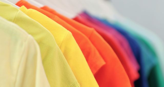 Colorful Shirts Hanging on Rack in a Row - Download Free Stock Images Pikwizard.com