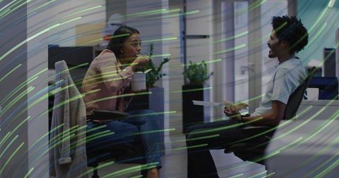 Coworkers enjoying lunch in modern office setting